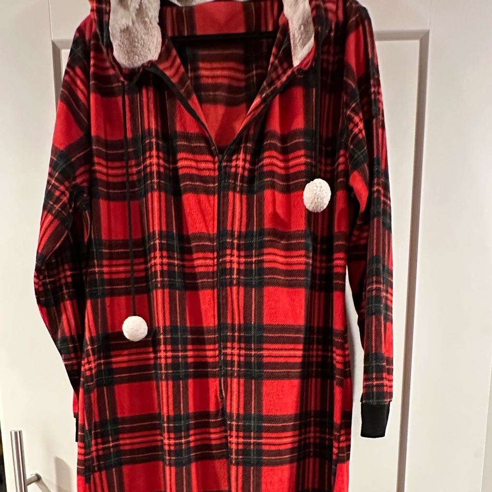 Onesie in red plaid fleece.